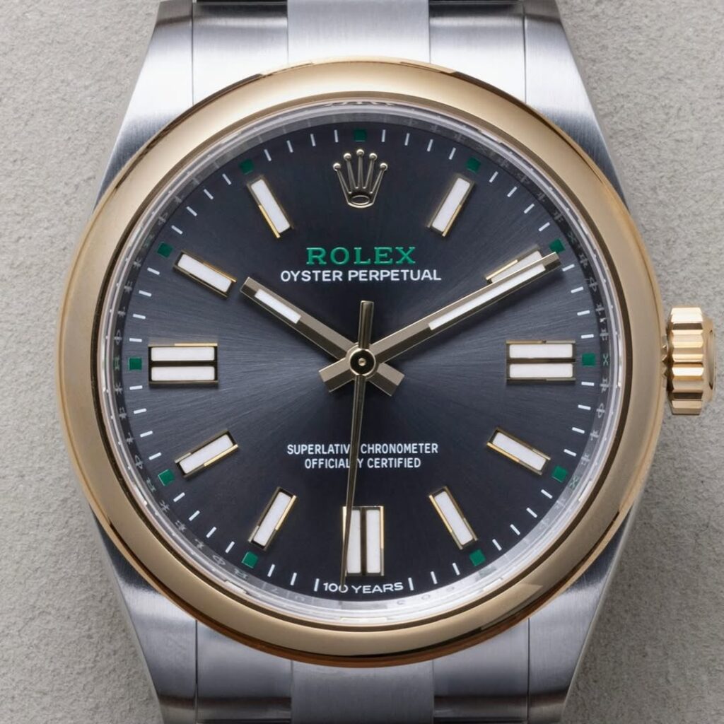 Full frontal alignment showing hand clearances, dial symmetry, and rehaut engraving.