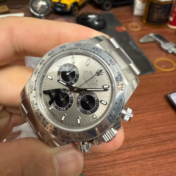 Angled view of VS Factory Rolex Daytona 126509 dial and metal tachymetric bezel